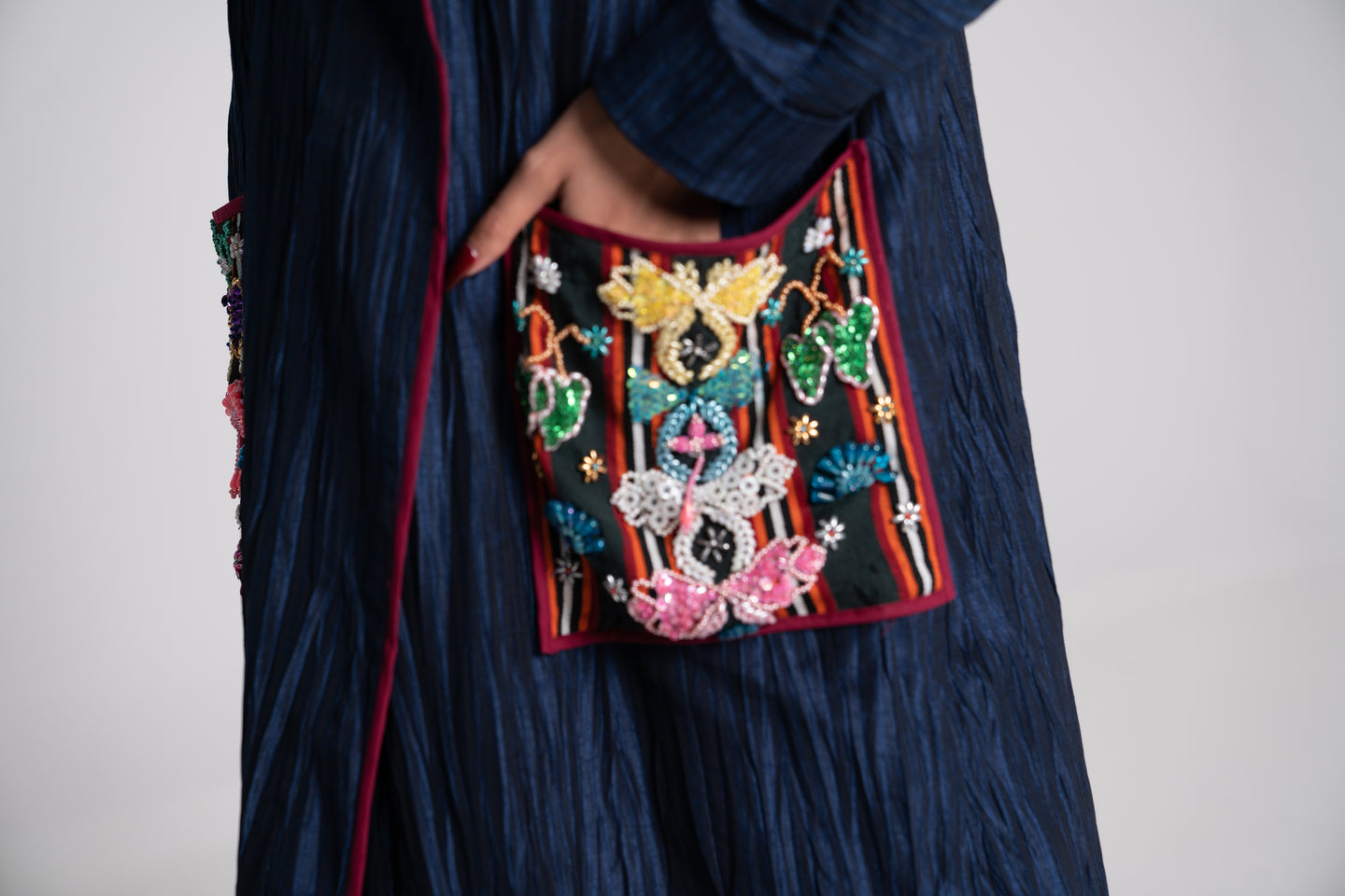 DALSH DESIGNS - Pleated coat with siwa embroidery